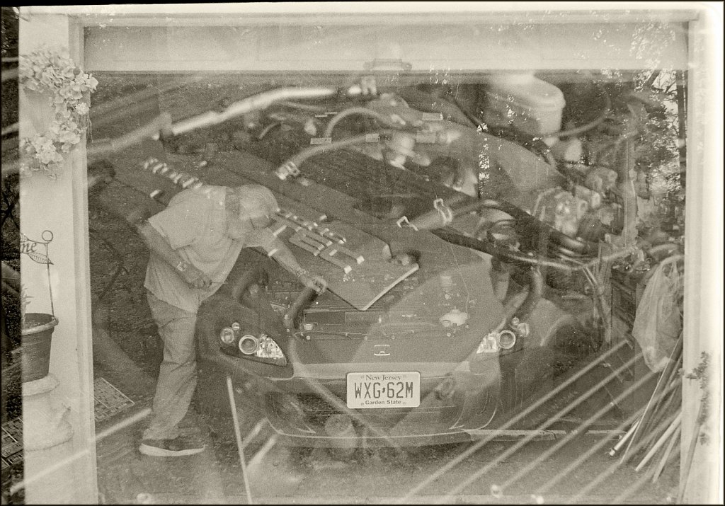 Double Exposed - Pop working on Honda
